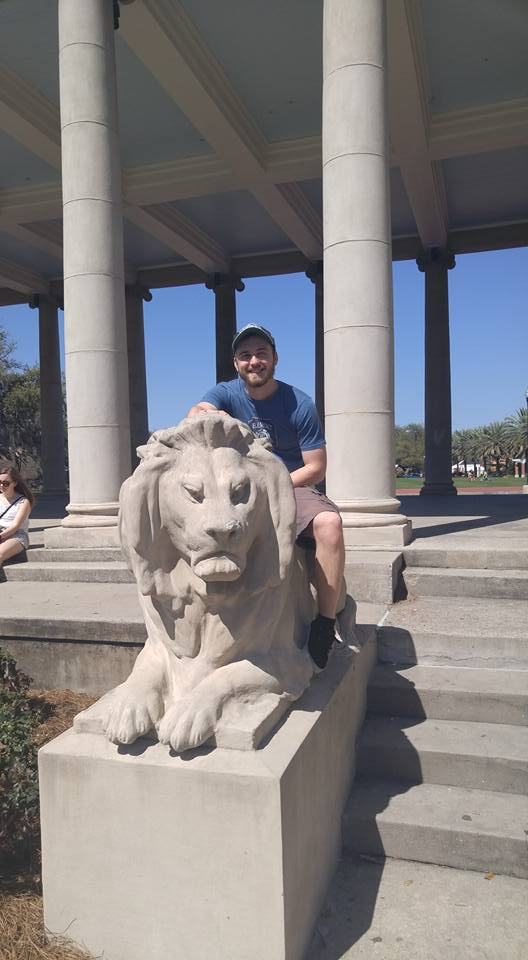 me sitting on a lion statue